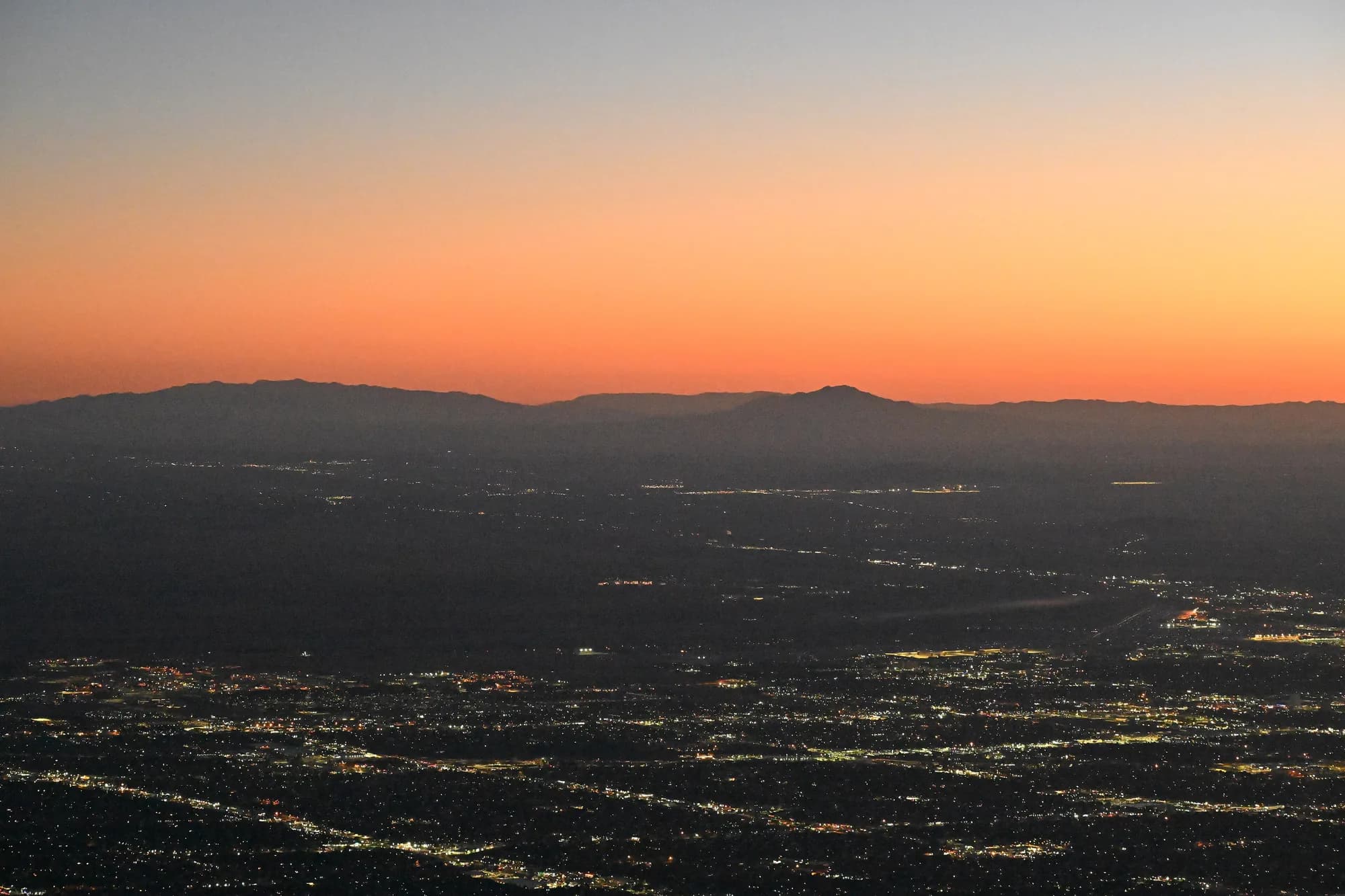 Albuquerque city lights spread across the valley at sunset