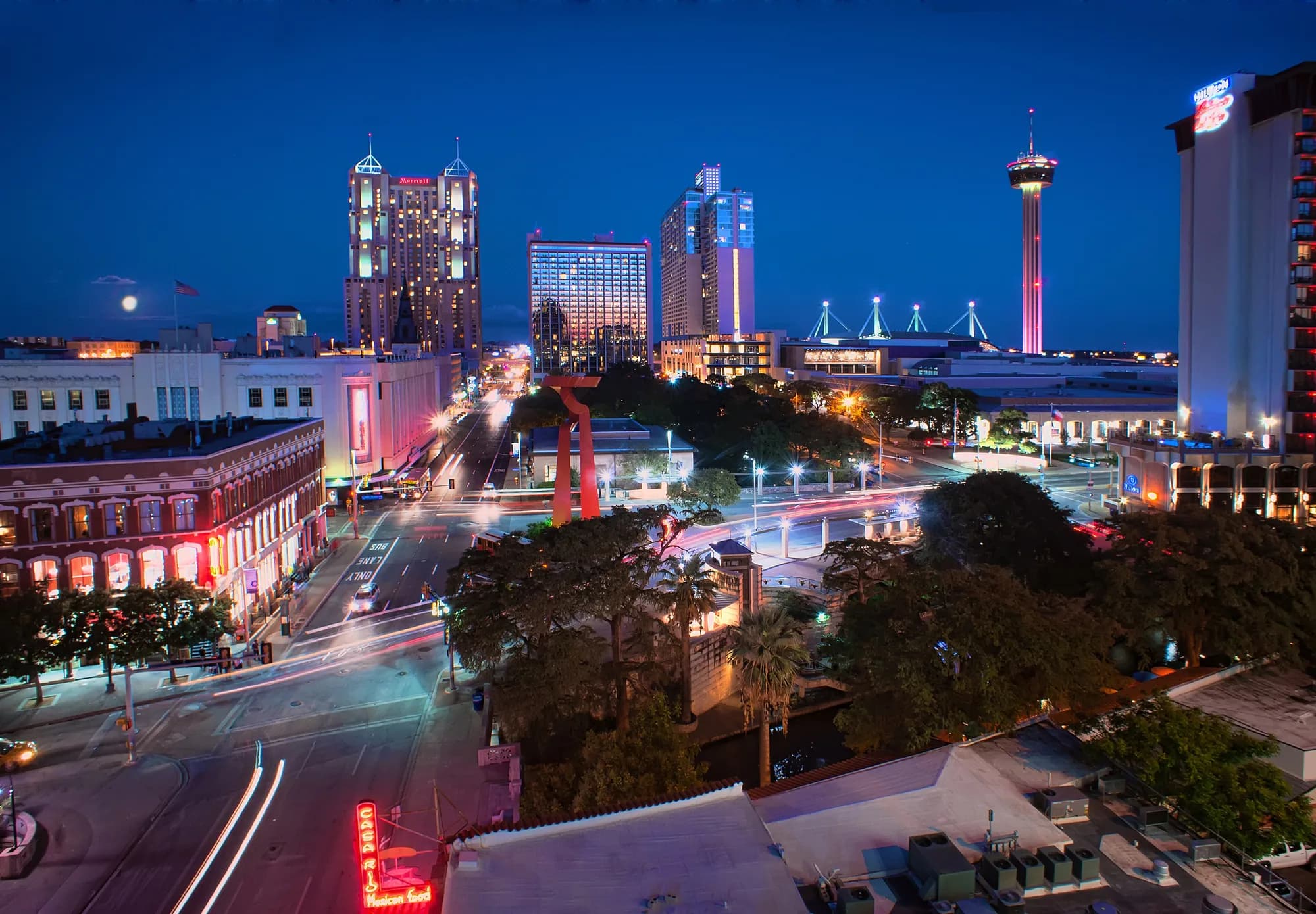 San Antonio at blue hour with the Tower of the Americas and downtown lit up