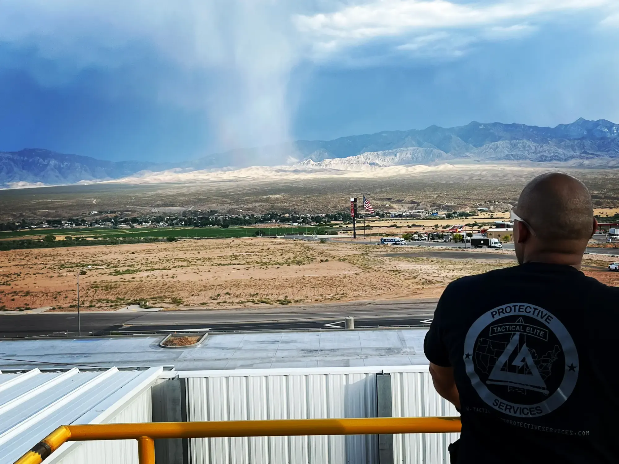 Officer surveying terrain from an elevated vantage point
